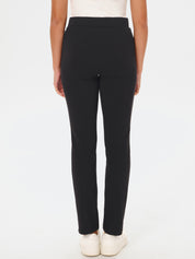 Black pants worn by a person on a white background
