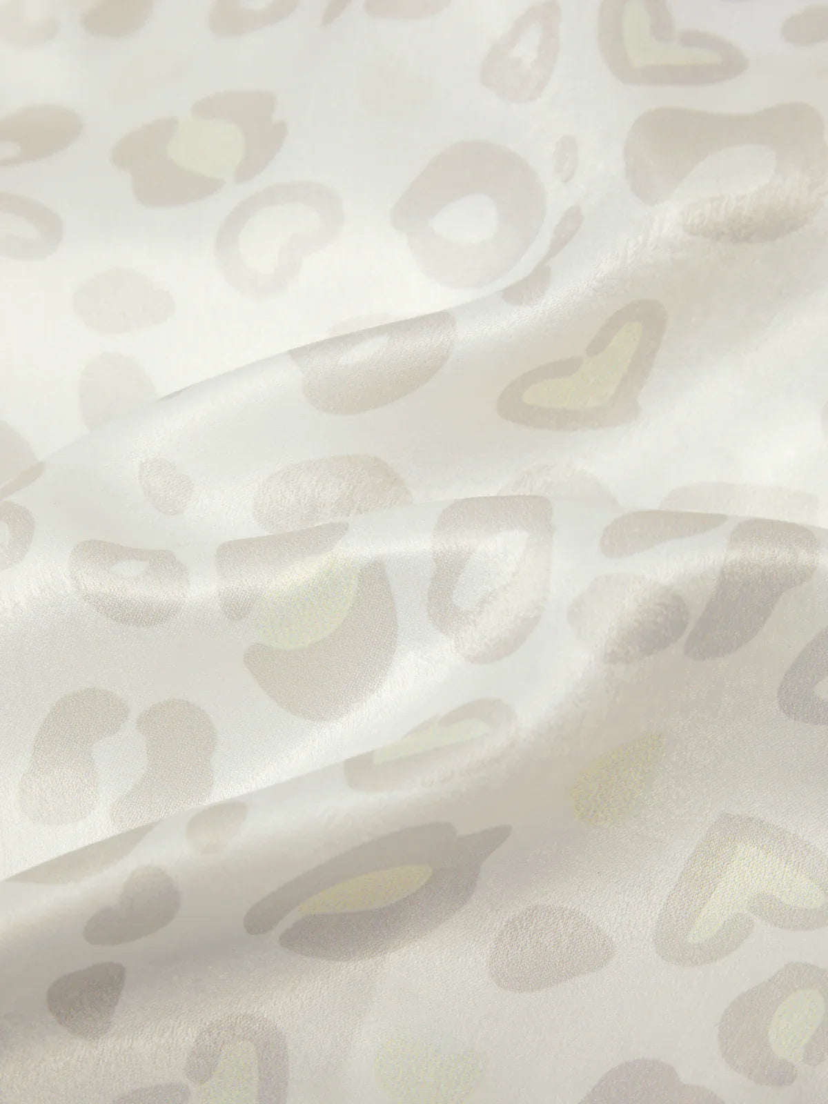 Close-up of a textured fabric with abstract pattern on a light background
