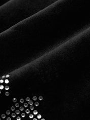 Close-up of black fabric with silver embellishments