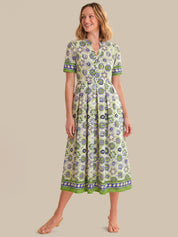 Woman wearing a floral dress on a beige background