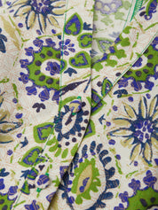 Close-up of fabric with a green and blue floral pattern