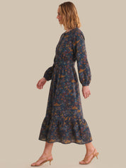 Woman wearing a floral dress on a beige background
