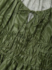 Close-up of green patterned fabric with a drawstring waist.