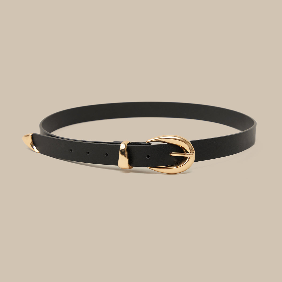 Black belt with a gold buckle on a beige background