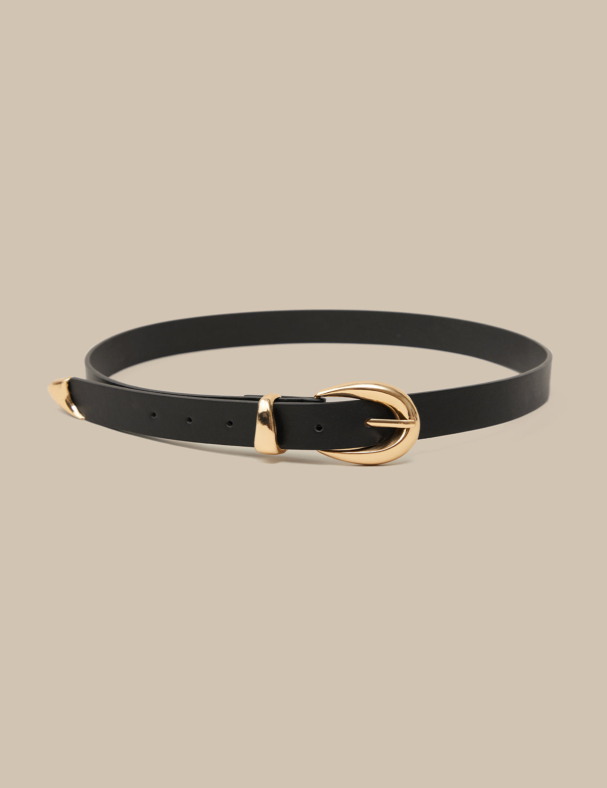 Black belt with a gold buckle on a beige background
