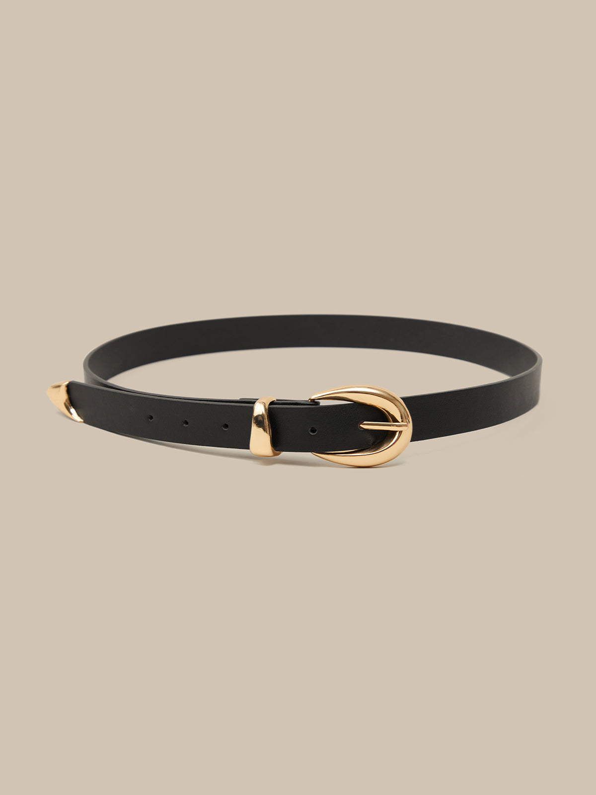 Black belt with a gold buckle on a beige background