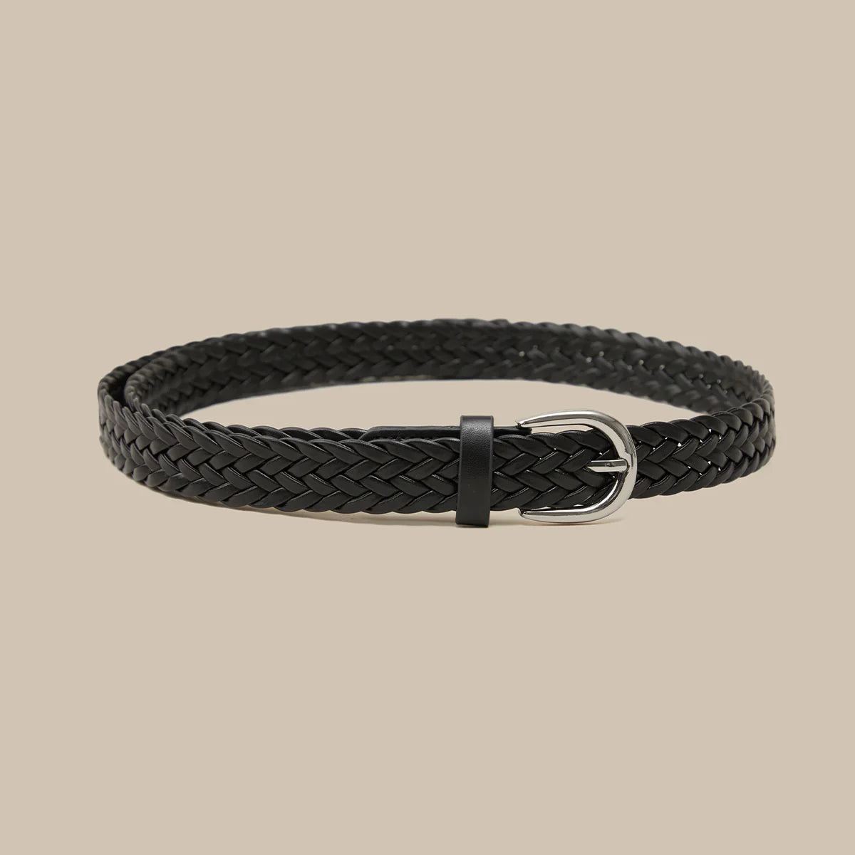 Black braided belt on a beige background