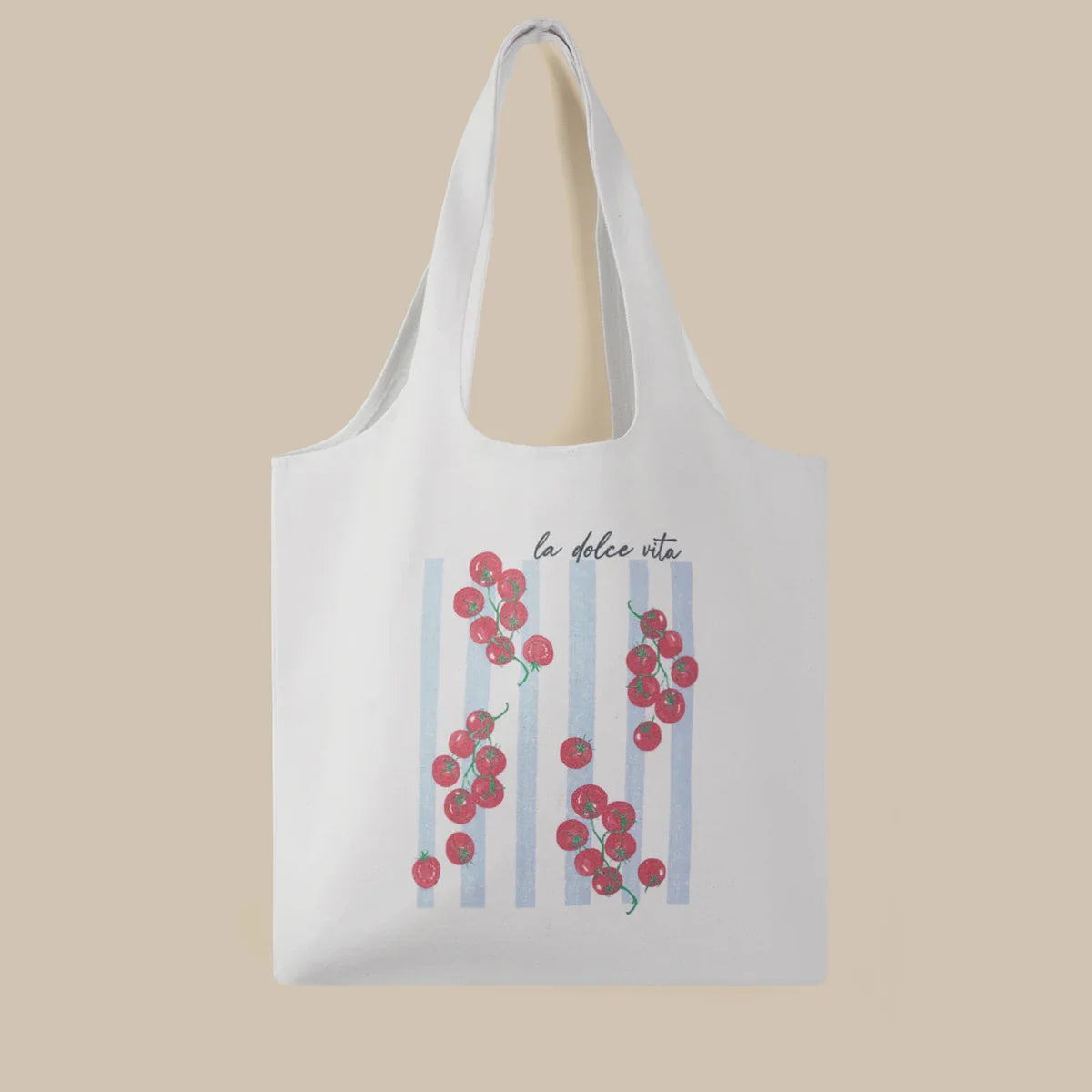 White tote bag with floral design and text on a beige background