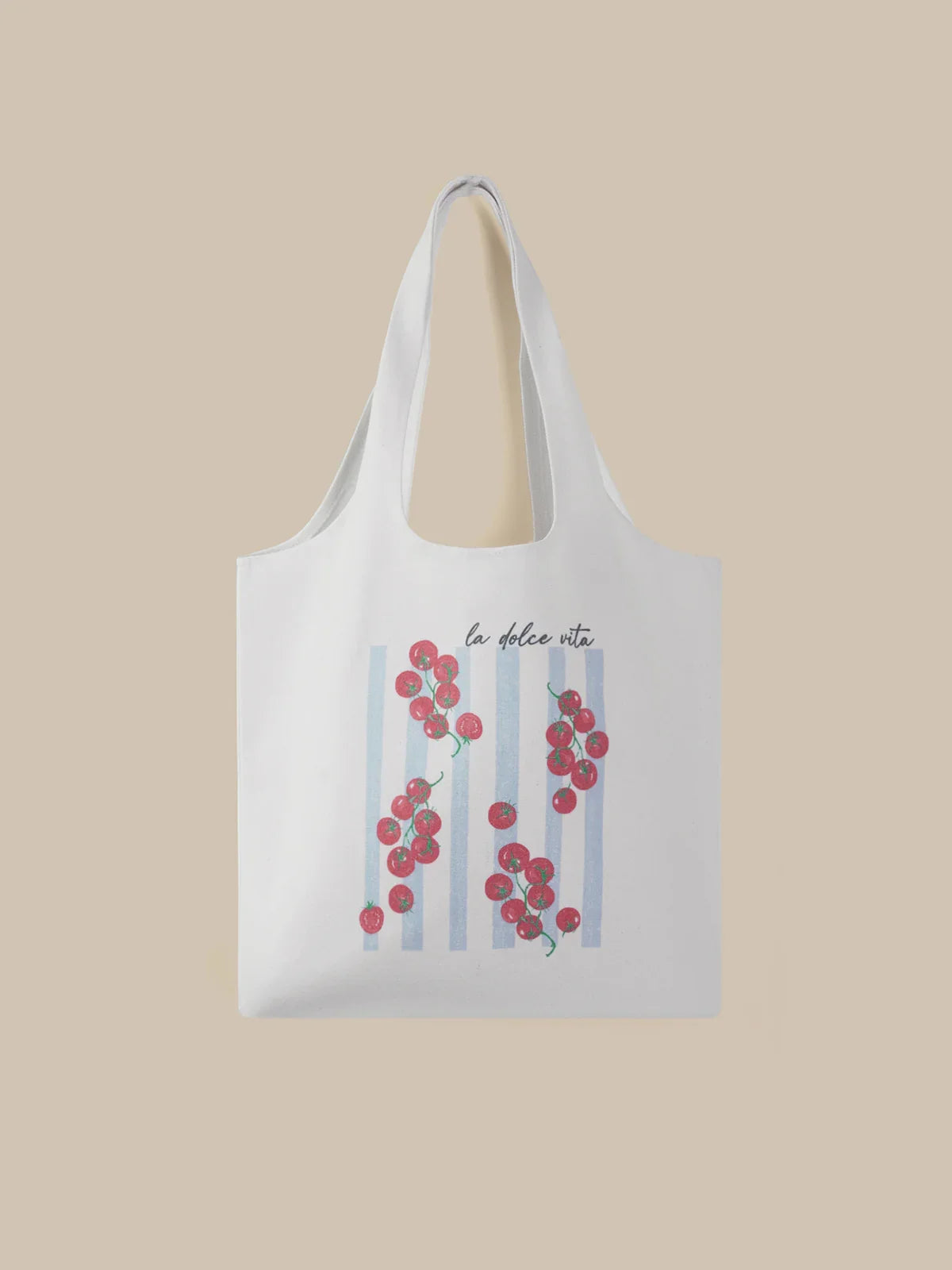 White tote bag with floral design and text on a beige background