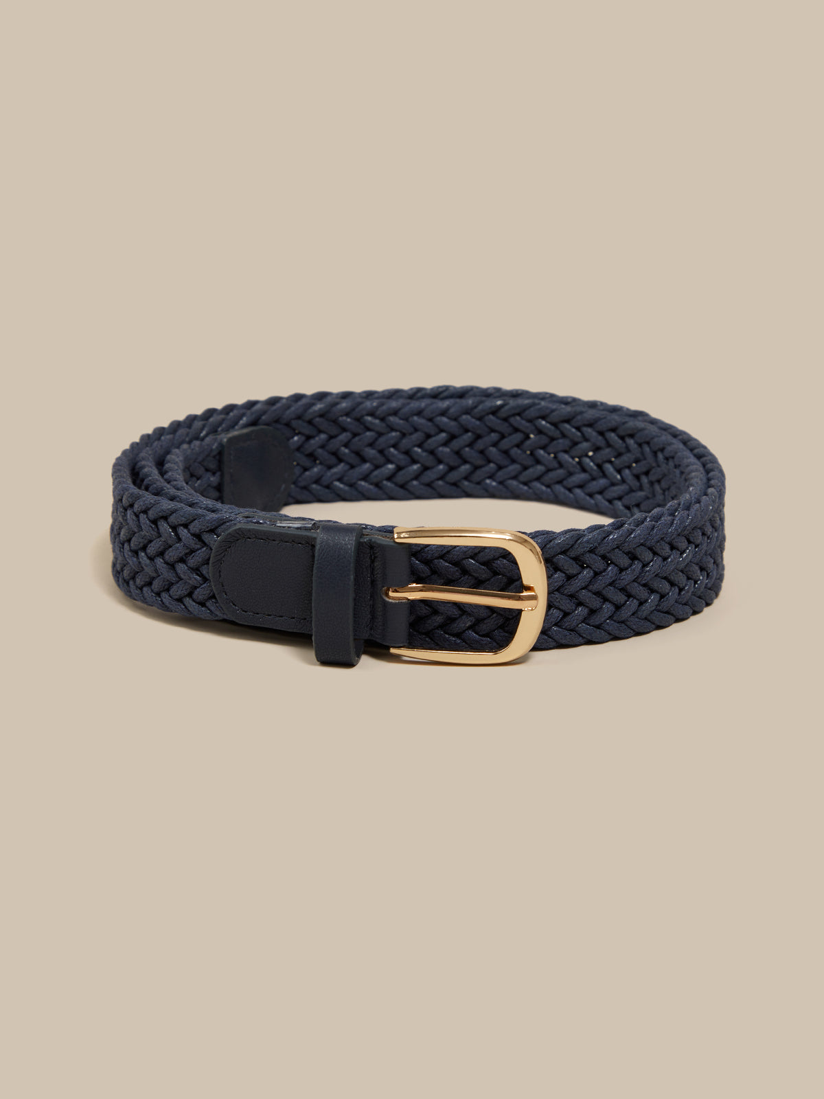 Navy braided belt with a gold buckle on a beige background