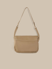 Beige shoulder bag on a beige background