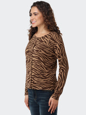 Woman wearing a brown and black zebra print long-sleeve cardigan on a white background