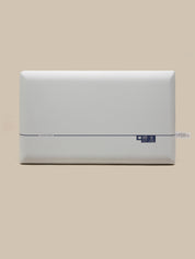A white rectangular pillow shown from the front against a solid beige background.