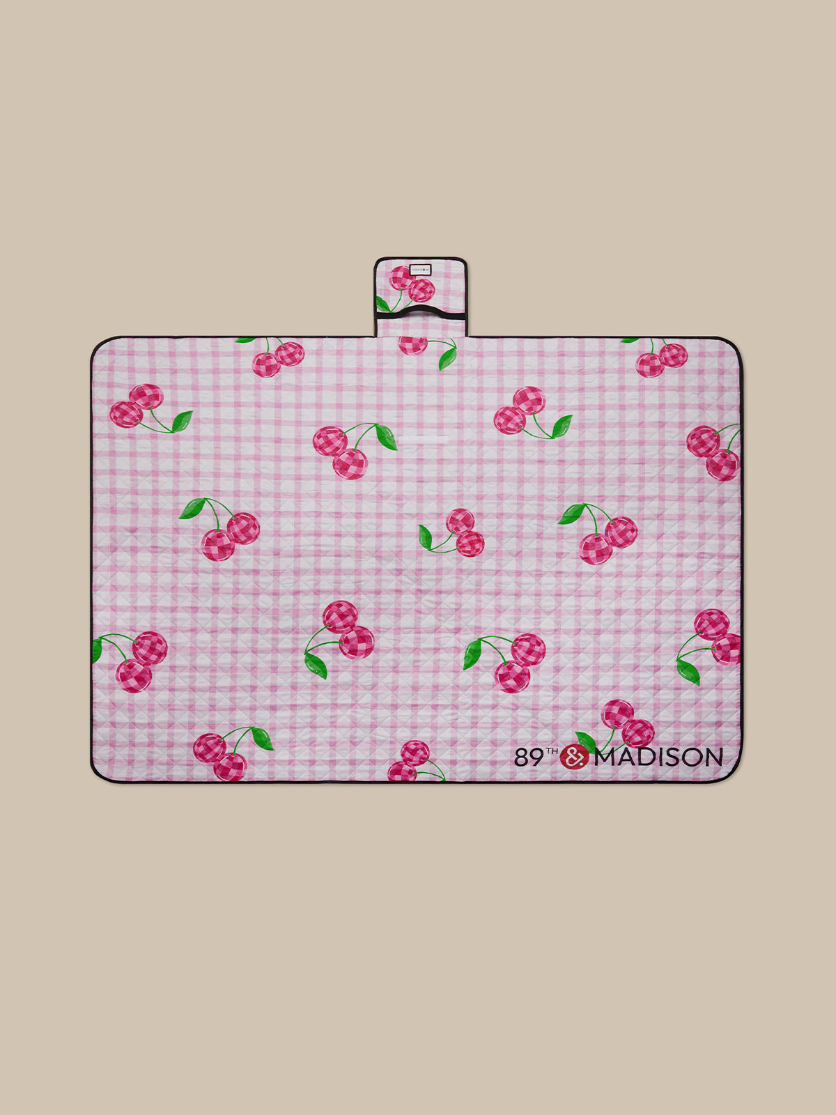 Pink checkered mat with cherry pattern on a beige background