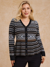 Woman wearing a patterned cardigan against a beige background