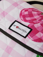 Close-up of a pink and white checkered bag with '89th & Madison' label.