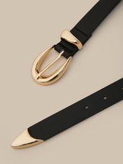 Black belt with gold buckle on a beige background
