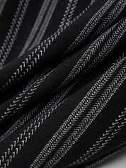 Close-up of black fabric with white stitching pattern