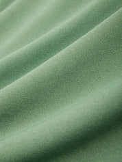 Close-up of green fabric with folds