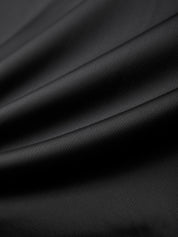 Close-up of black leather fabric with a subtle texture