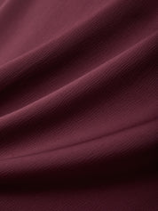 Close-up of dark purple fabric with folds