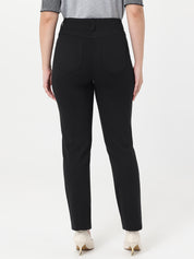 Black pants worn by a person on a white background