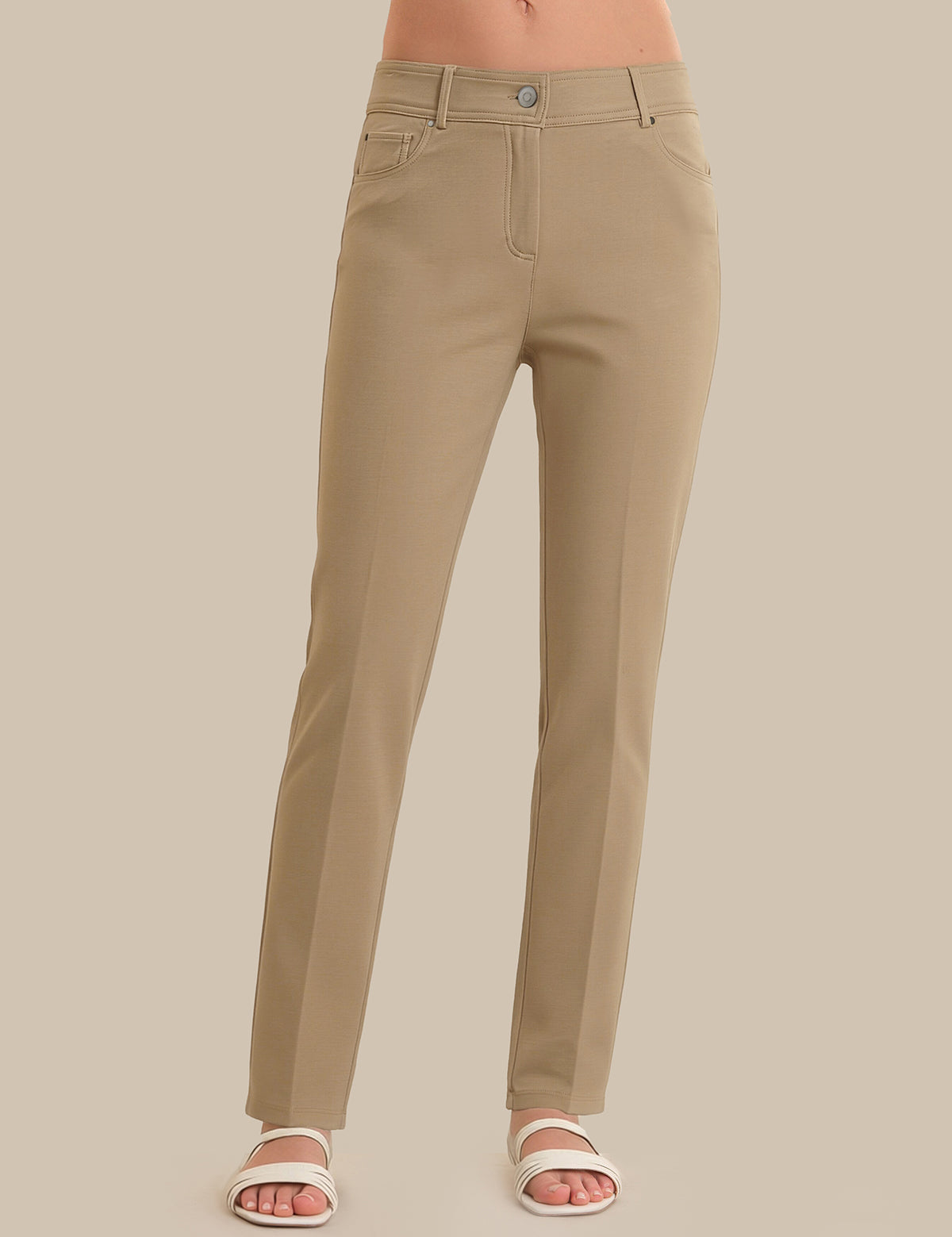Beige pants on a neutral background