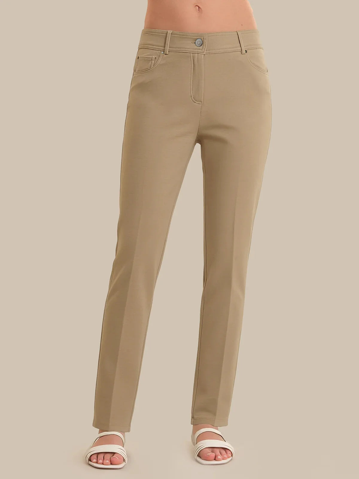 Beige pants on a neutral background