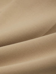 Close-up of beige fabric with folds