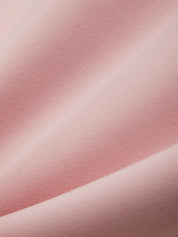 Close-up of pink fabric with a subtle texture