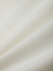 Close-up of a beige fabric texture