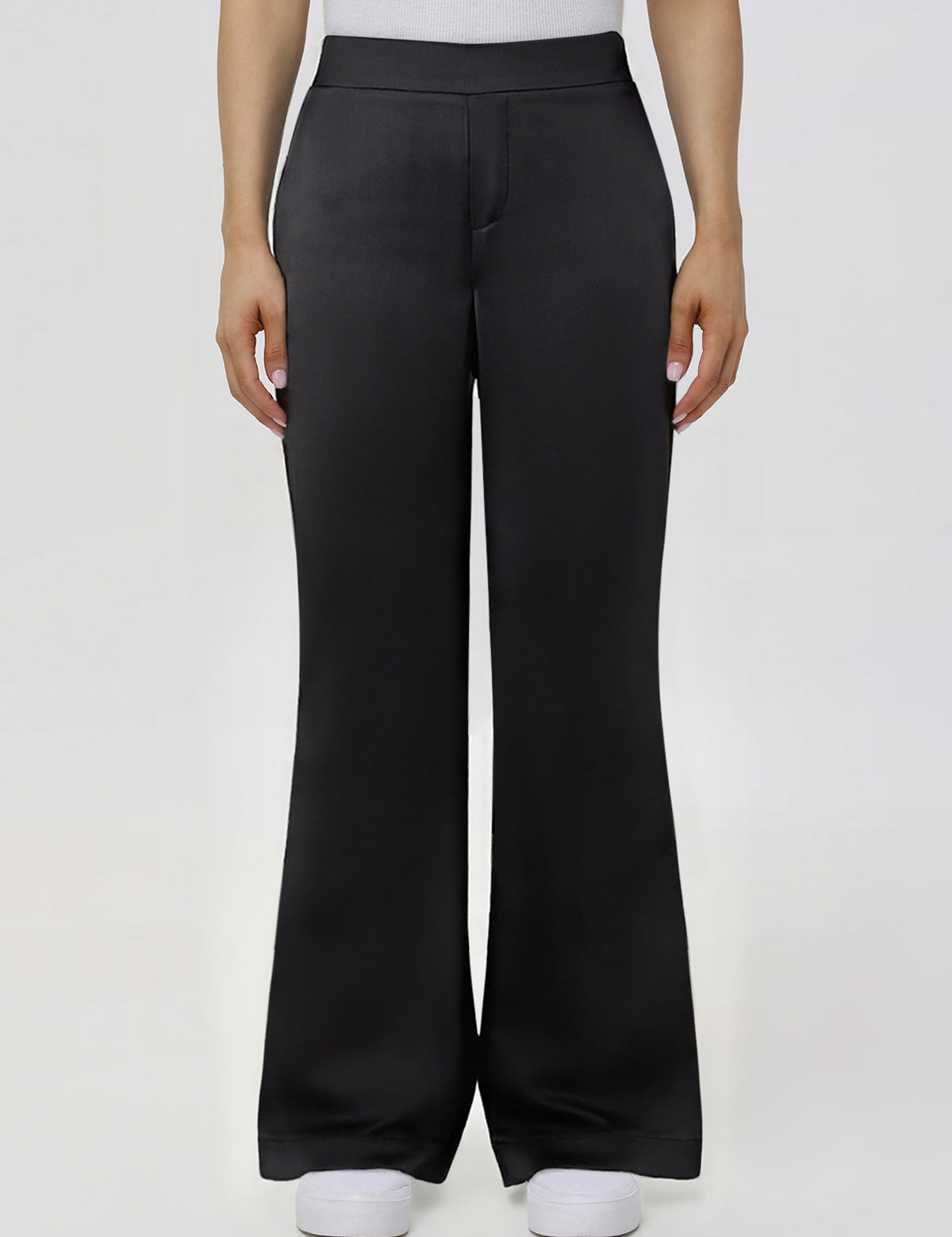 Black wide-leg pants worn by a person on a white background
