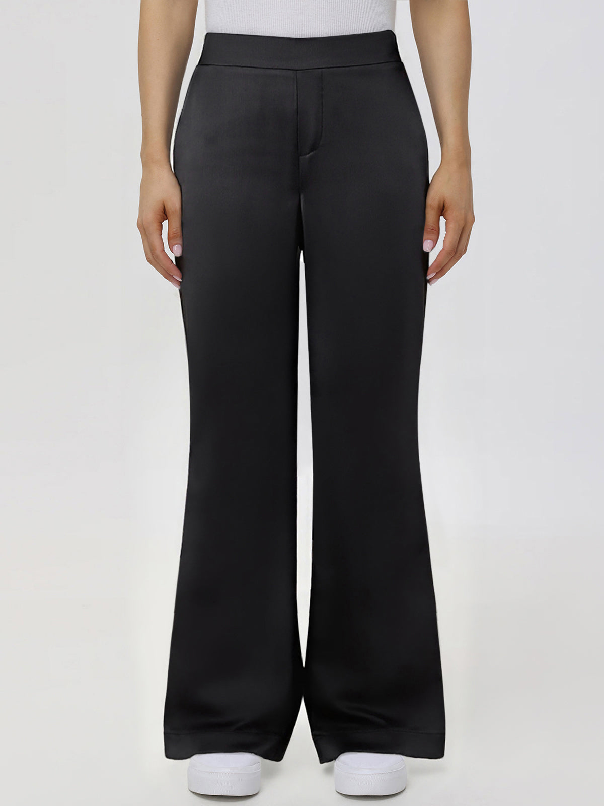 Black wide-leg pants worn by a person on a white background
