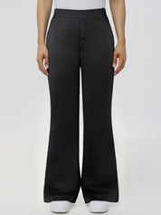 Black wide-leg pants worn by a person on a white background