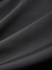 Close-up of dark gray fabric with visible texture