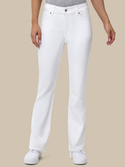 Person wearing white jeans on a beige background
