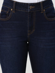 Close-up of dark blue jeans on a white background
