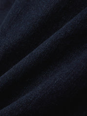 Close-up of dark blue fabric with a textured surface