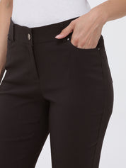 Brown pants with white buttons on a plain background