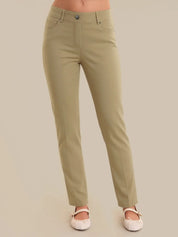 Khaki pants worn by a person on a beige background