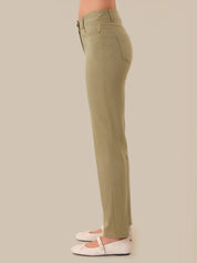 Khaki pants worn by a person on a beige background