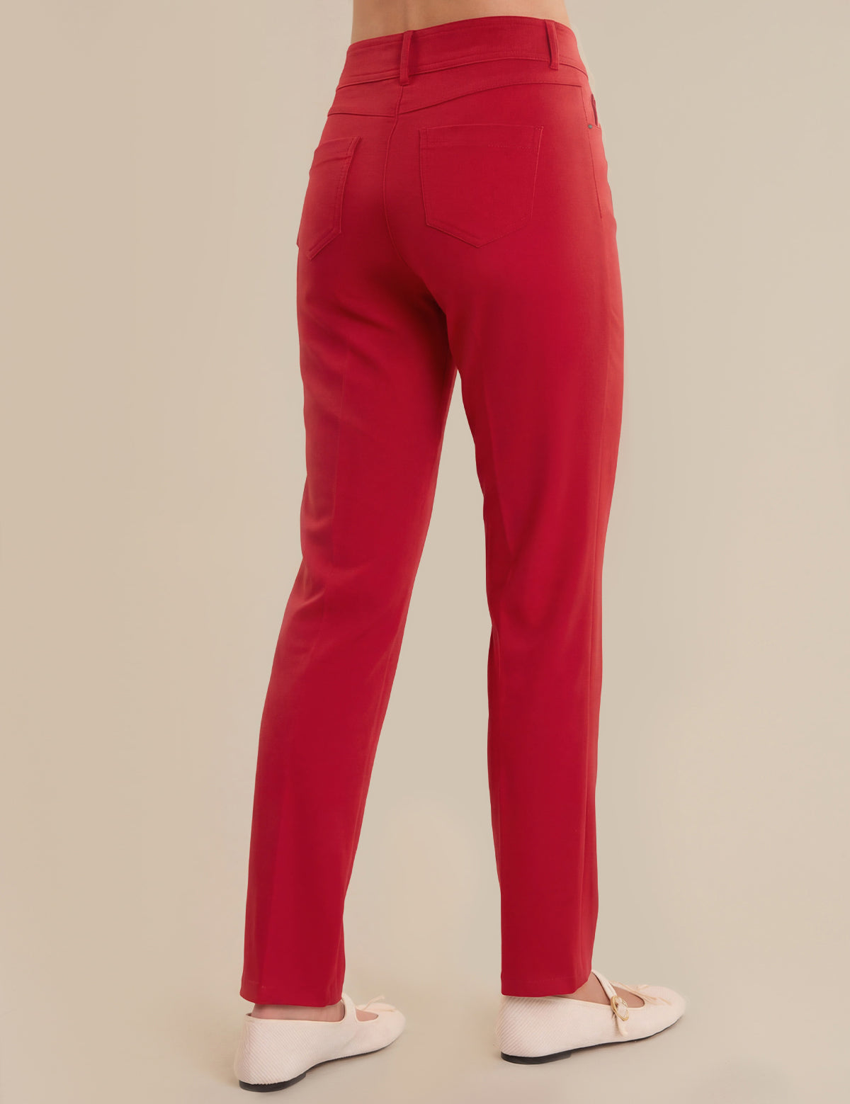 Red pants on a beige background