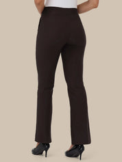 A person shown from the back wearing dark brown high-waisted flared pants with black high heels against a plain beige studio background.