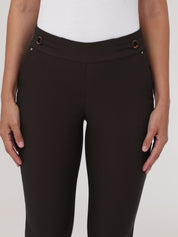 Brown pants worn by a person on a light gray background