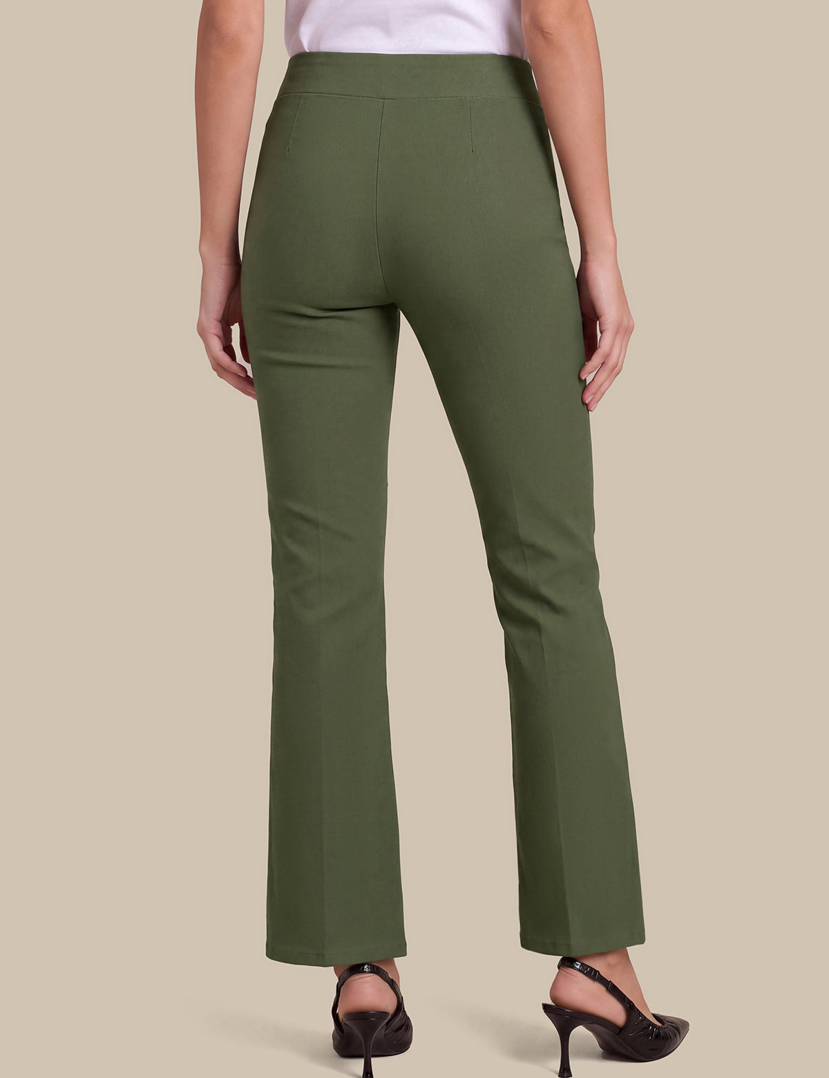A model shown from the back wearing olive green high-waisted straight-leg trousers, a white top, and black high-heeled sandals against a solid beige background.