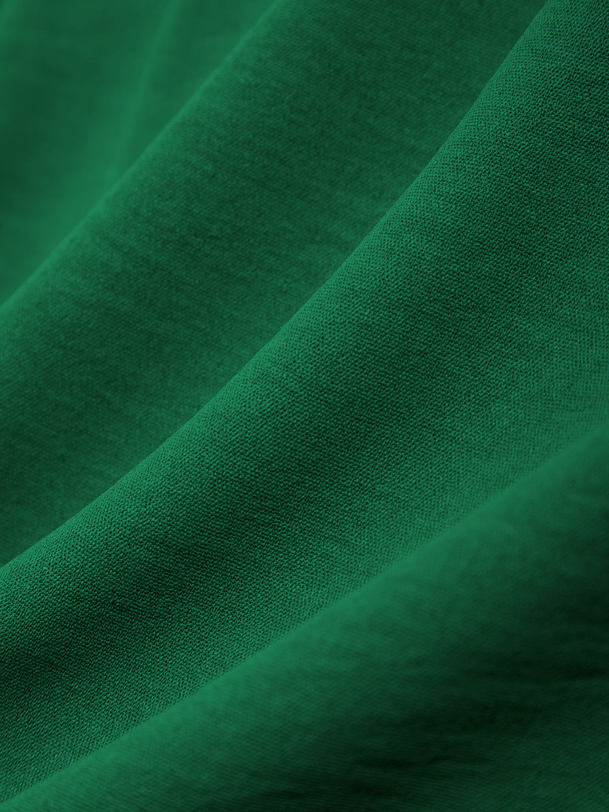 Close-up of green fabric with a textured surface