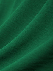 Close-up of green fabric with a textured surface