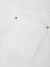 Close-up of a white shirt with button details on a light gray background