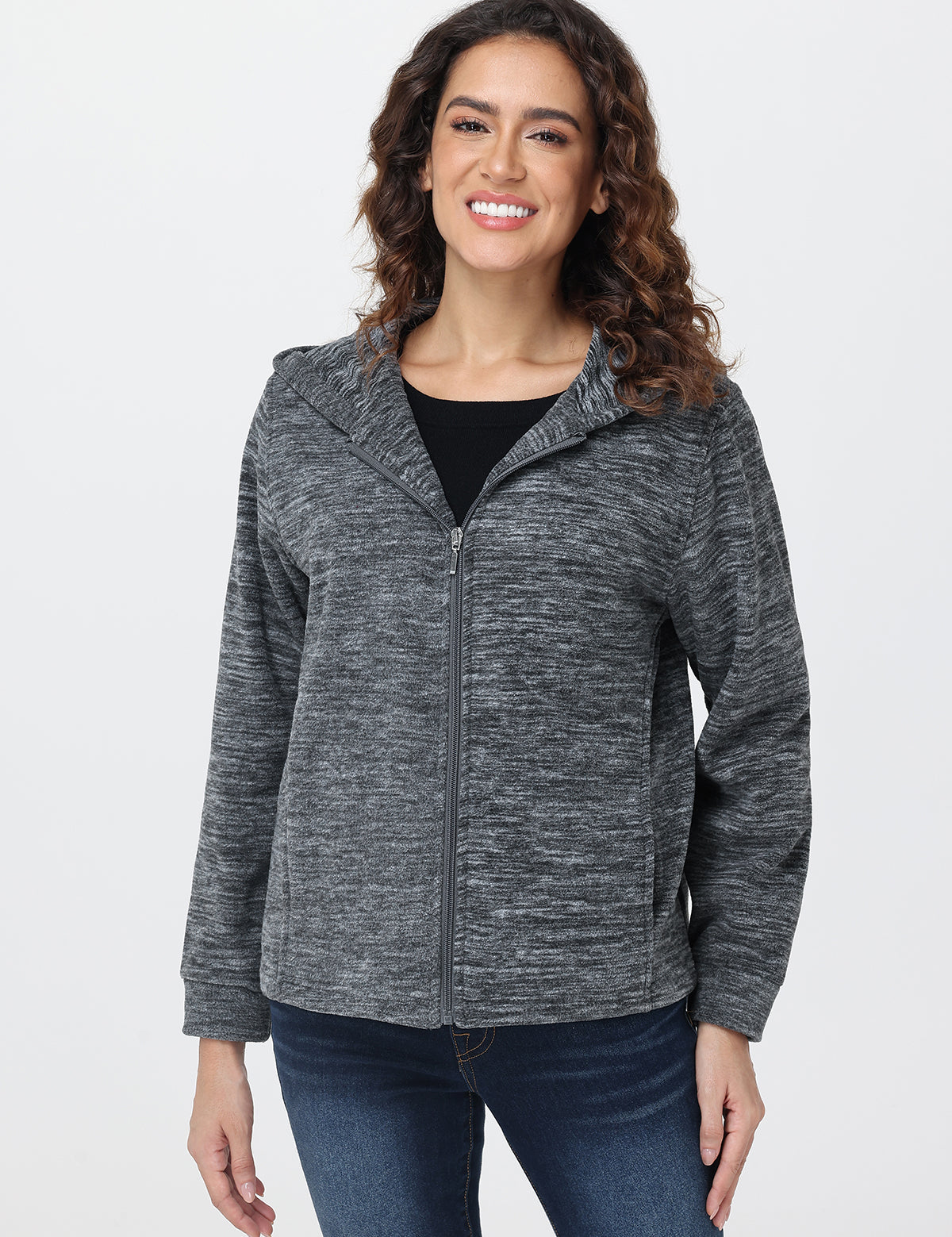 Woman wearing a gray zip-up hoodie on a white background