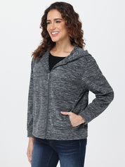 Woman wearing a gray zip-up hoodie on a white background